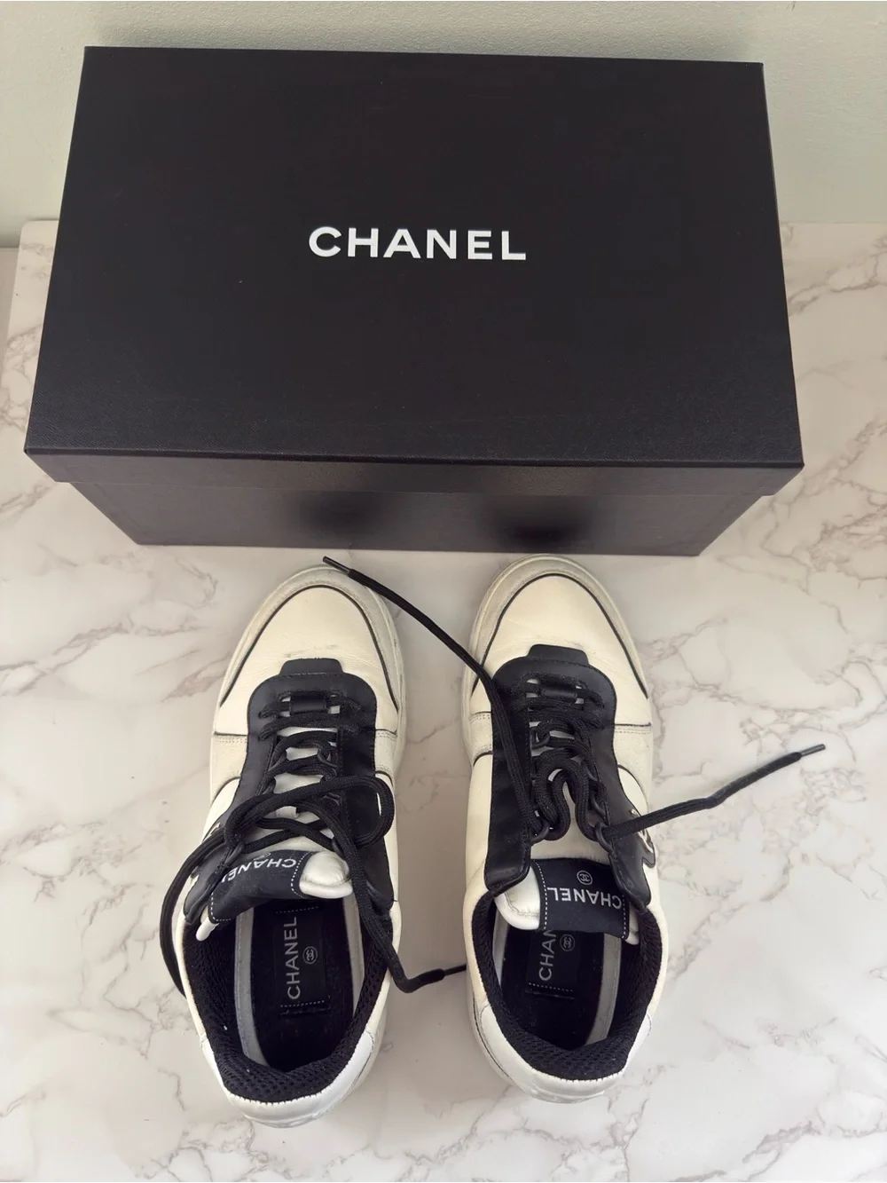 CHANEL Leather Cream and Black CC Charm Low-Top Sneakers